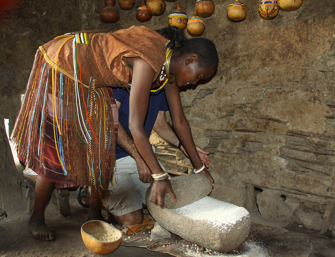 Datoga woman milling flour