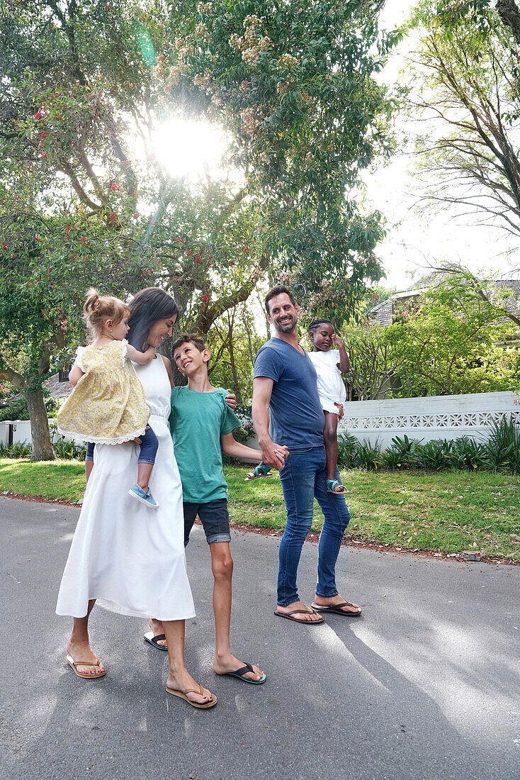 Parents with children walking on street