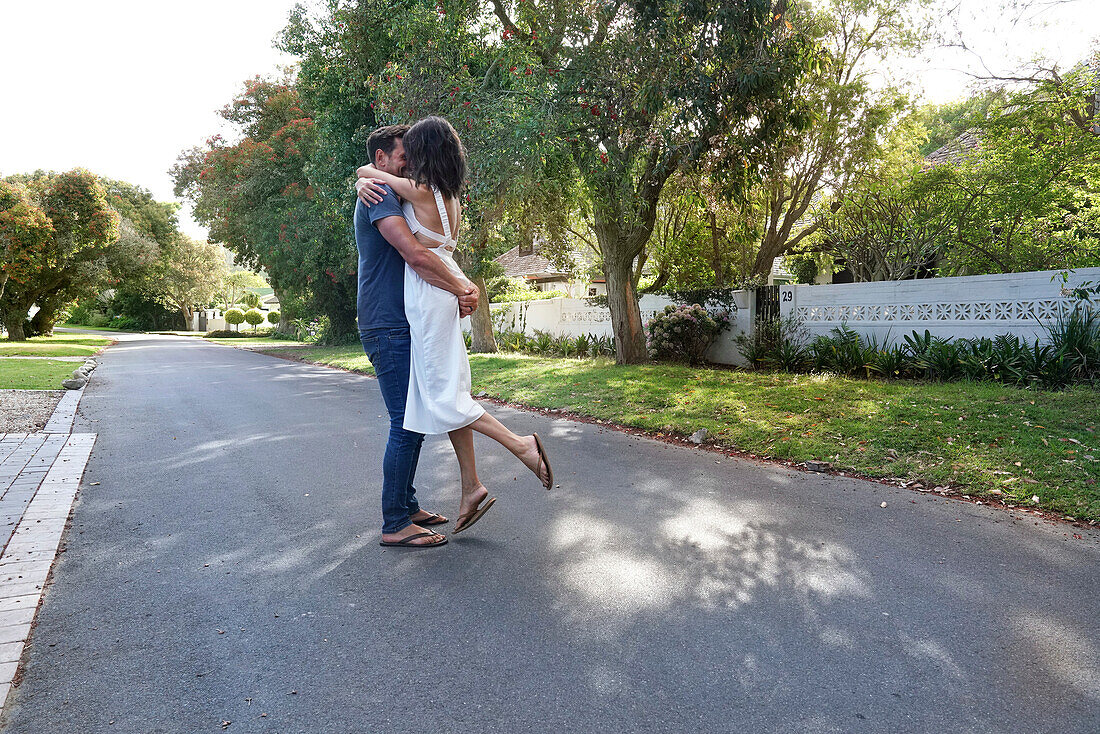 Couple embracing on street