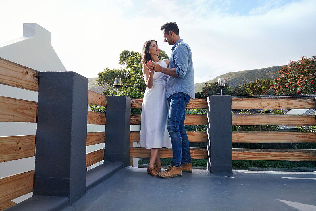 Couple embracing on terrace