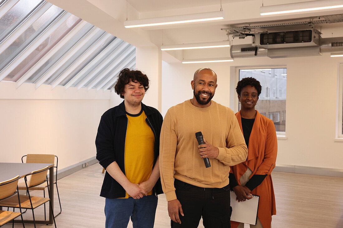 Smiling creative team having presentation in studio