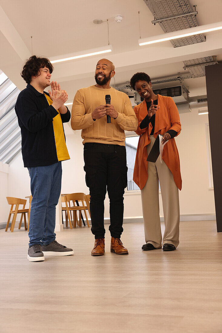 Smiling creative team having presentation in studio