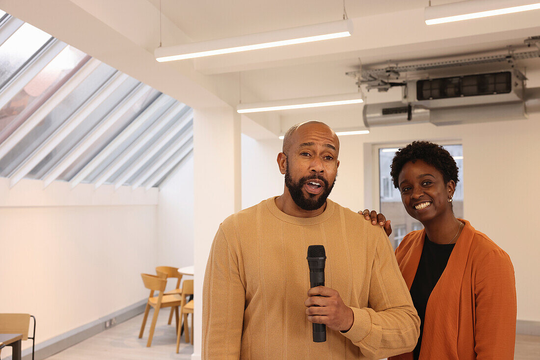 Portrait of smiling creative team having presentation in studio