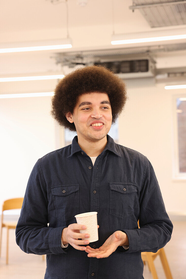 Smiling man standing in office