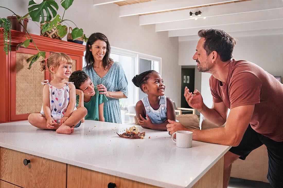 Parents with children in kitchen