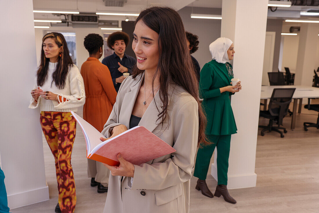 Employee smiling during team meeting