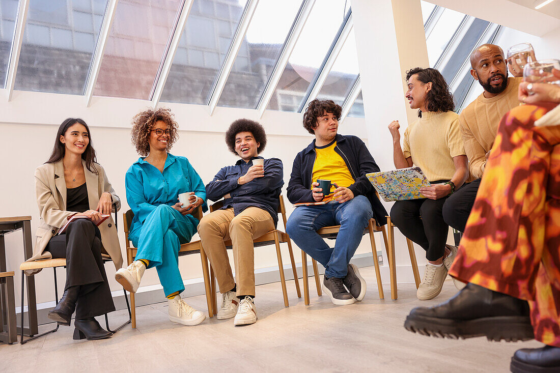 Employees at team meeting