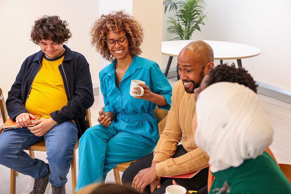 Company employees smiling in team meeting