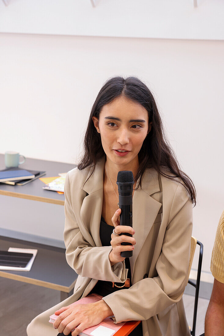 Woman holding microphone