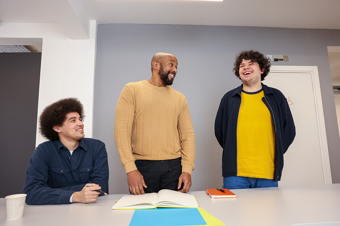 Employees working together in office