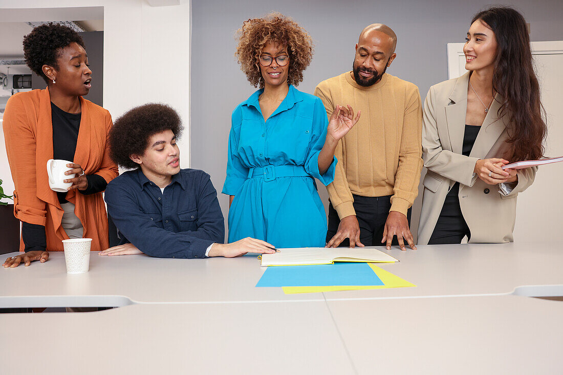 Employees working together at desk