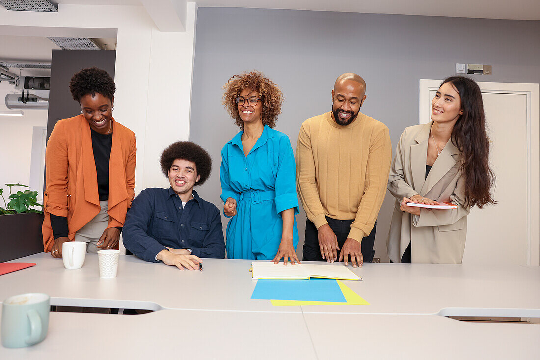 Employees working together at desk