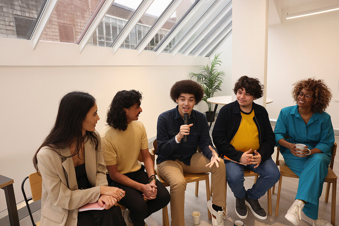 Creative workers having meeting in office