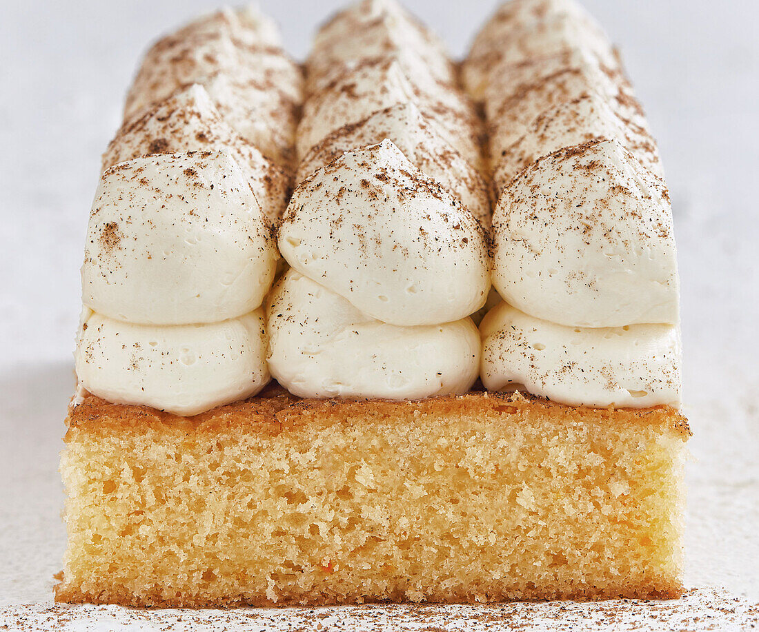 Eggnog sheet cake with cream topping