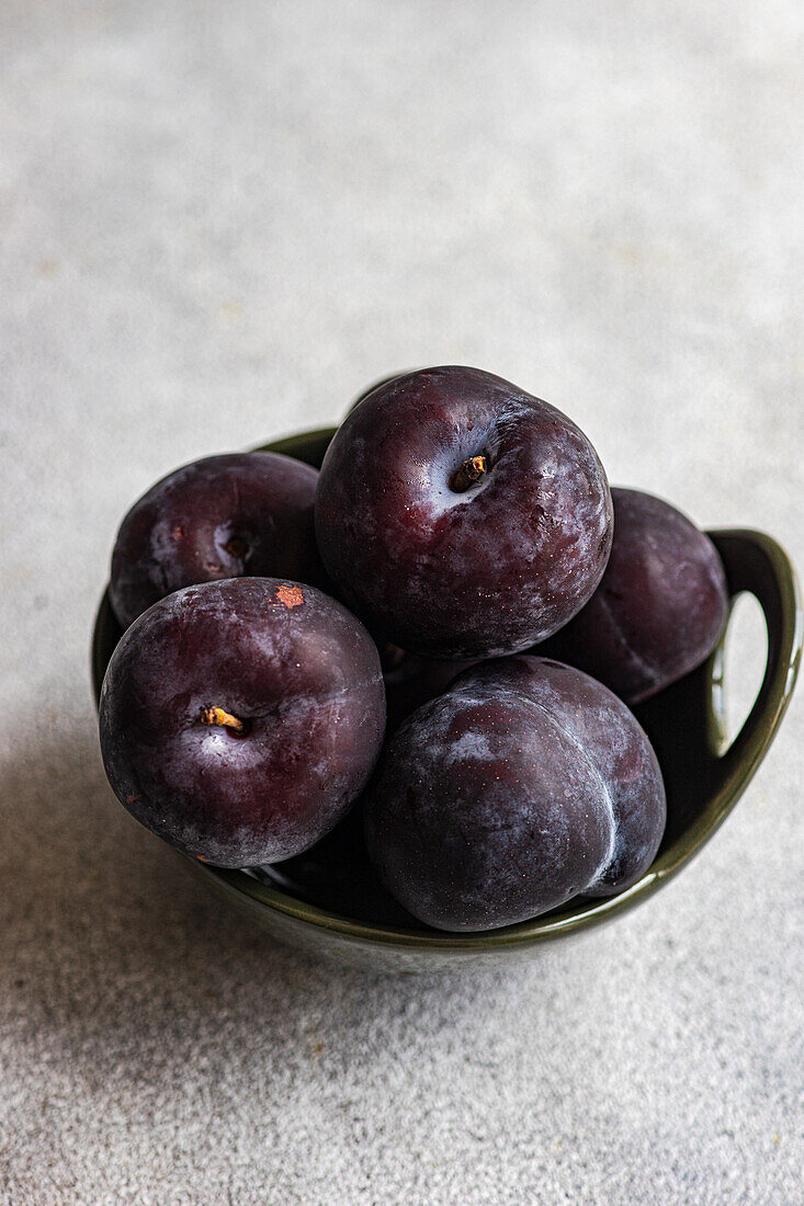 Bowl of ripe plums