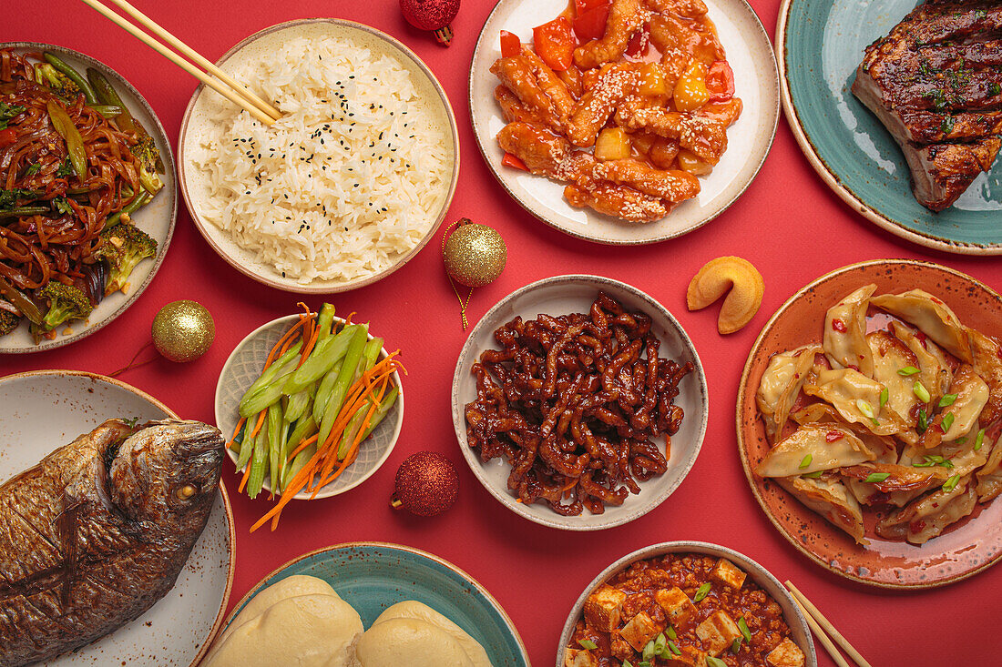 Traditional Chinese New Year dishes with Christmas decorations