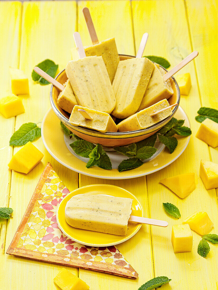 Homemade mango-mint ice cream on a stick