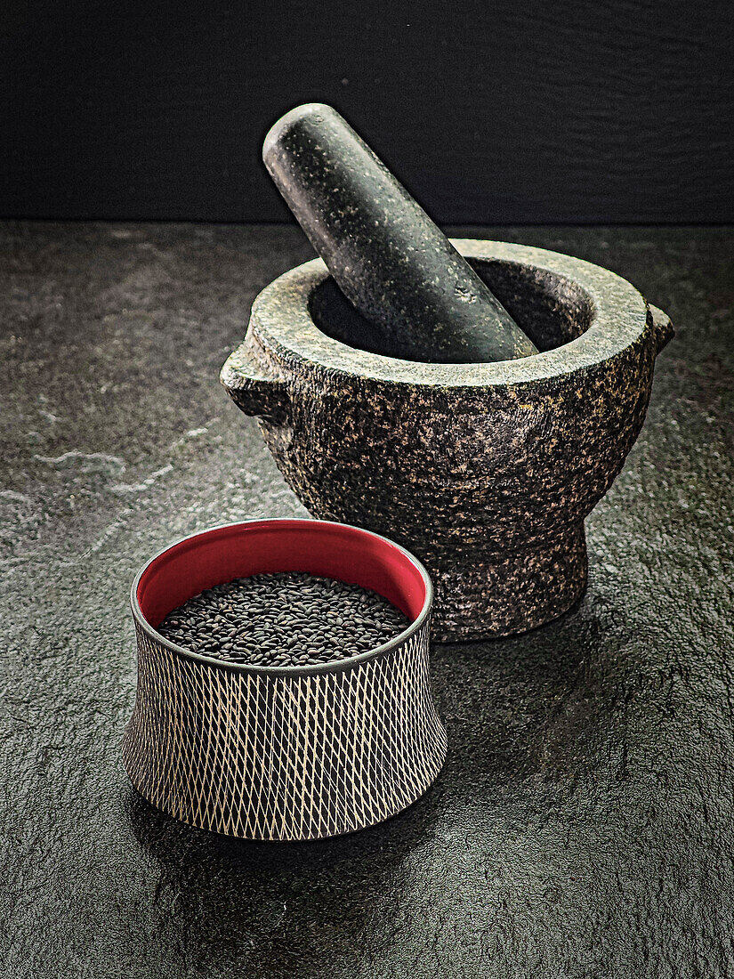 Stone mortar with black sesame seeds