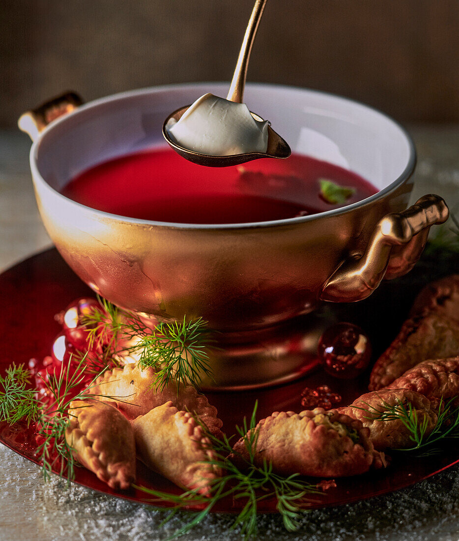 Russian borscht with salmon and pierogi