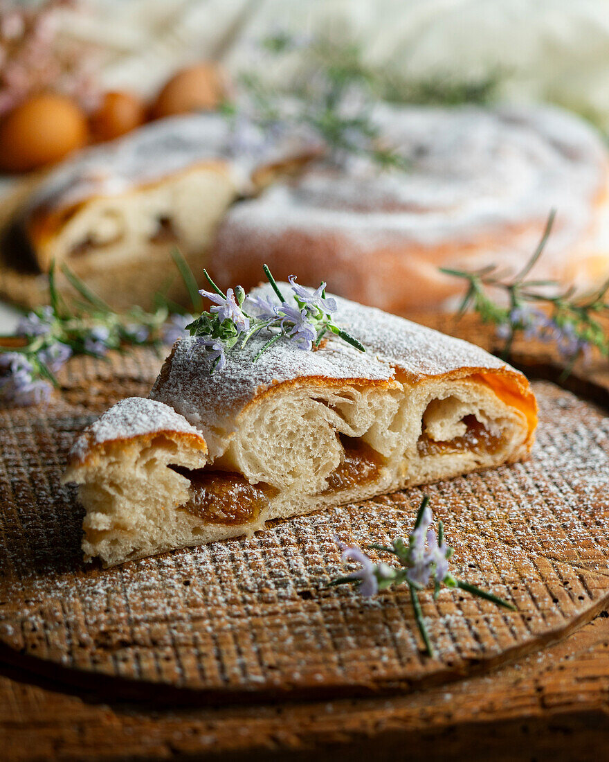 Sliced ensaimada from Mallorca sprinkled with icing sugar