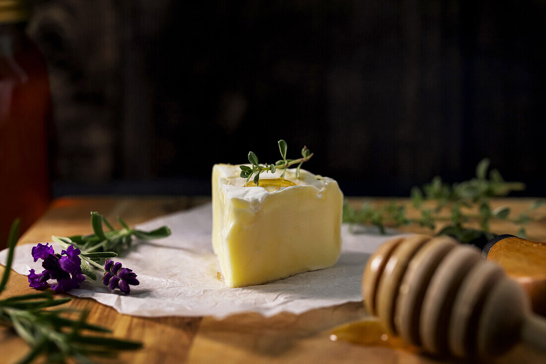 Brie cheese with honey and fresh herbs