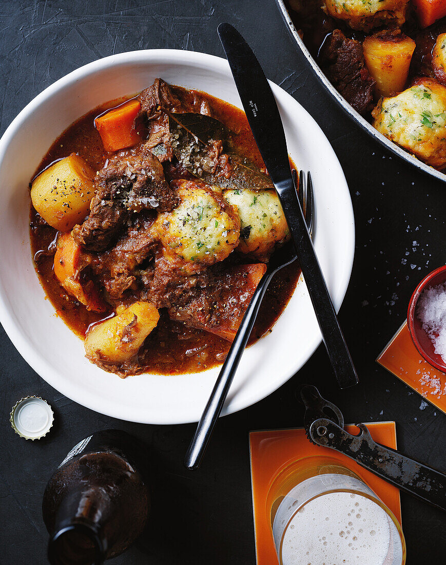 Traditional meat stew with herb dumplings