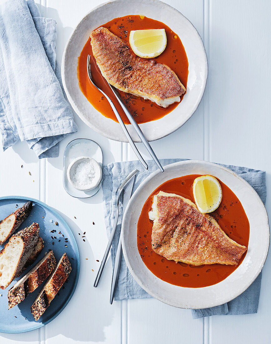 Coral trout with tomato and seaweed sauce and bread