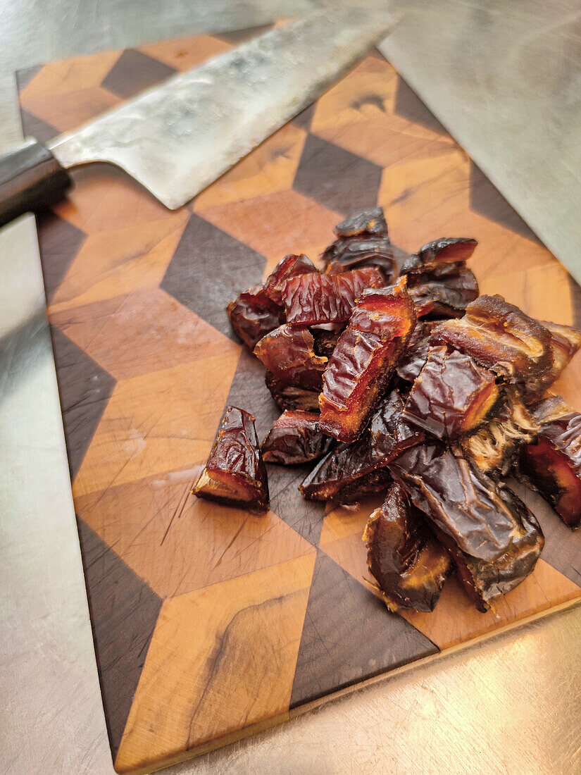 Chopped dates on a wooden board