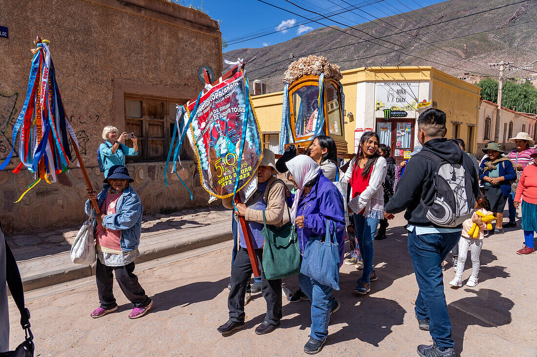 Parishioners carry a statue of the Virgin in a religious procession in the town of Tilcara, Argentina.