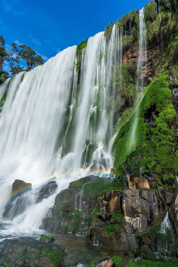 A small rainbow at Bossetti Falls at Iguazu Falls National Park in Argentina. A UNESCO World Heritage Site.