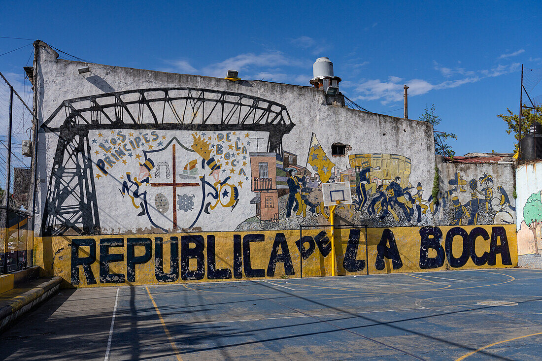 A mural of scenes from La Boca painted on the wall of a basketball court in La Boca, Buenos Aires, Argentina.