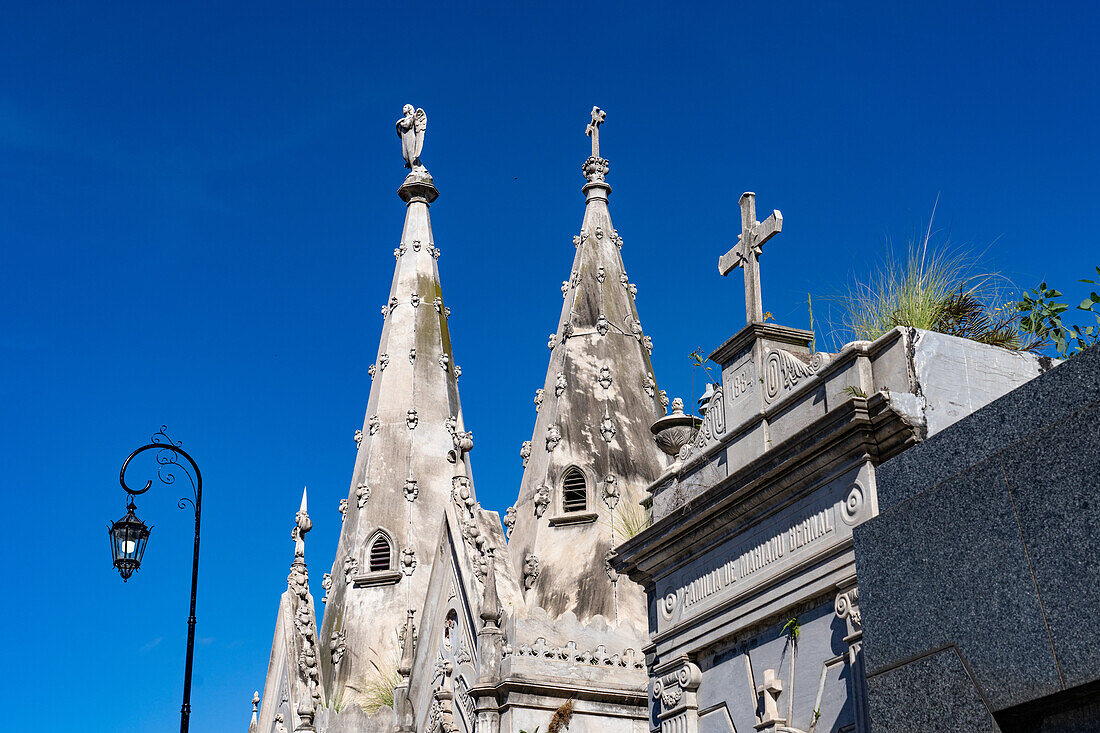 Architectural detail of elaborate spires on a mausoleum in the Recoleta Cemetery in Buenos Aires, Argentina.