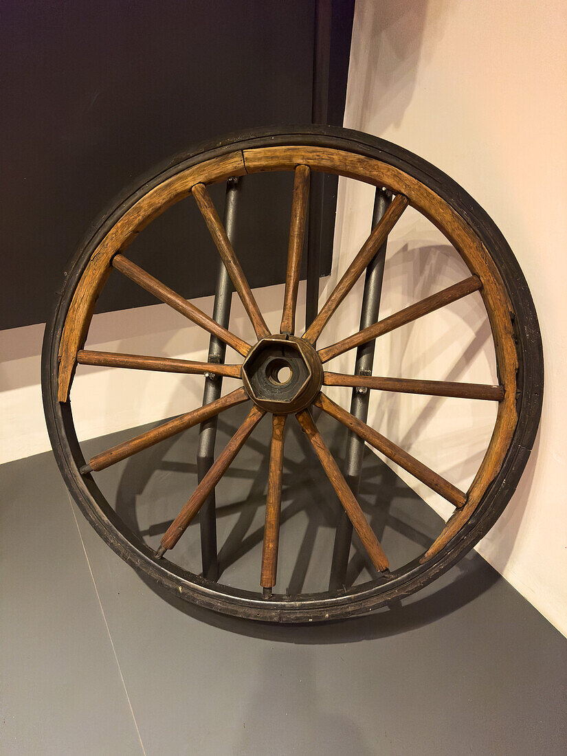 An antique wooden wagon wheel in the Juan Lavalle Historical Provincial Museum, San Salvador de Jujuy, Argentina.