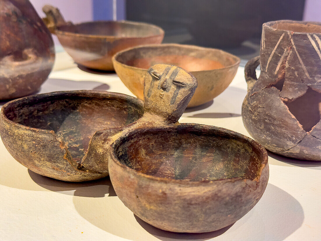 Pre-Hispanic ceramic pottery from the Humahuaca Valley. Dr. Eduardo Casanova Archeology Museum, Tilcara, Argentina. Bowls with handle shaped like a human face.