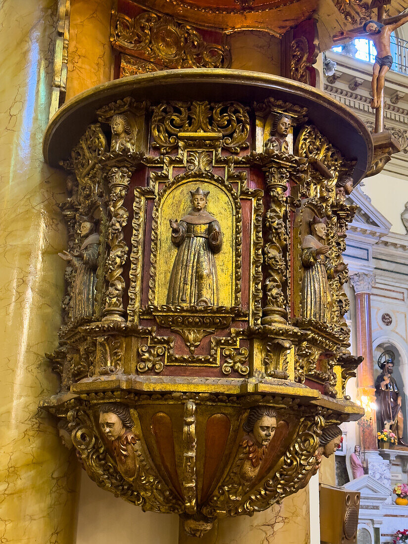 The ornately-carved wooden pulpit in the Basilica of San Francisco in San Salvador de Jujuy, Argentina.