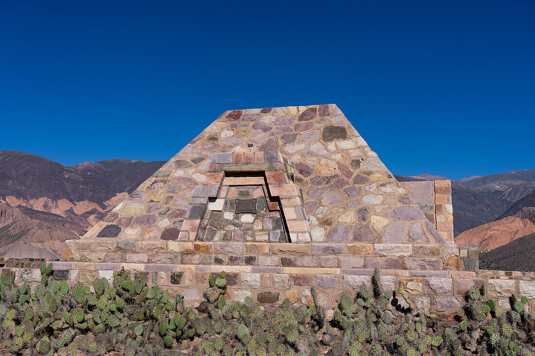 A modern pyramid built in the ruins in the Pucara of Tilcara, a pre-Hispanic archeological site near Tilcara, Argentina. The pyramid is a memorial to the archeologists who excavated the ruins.