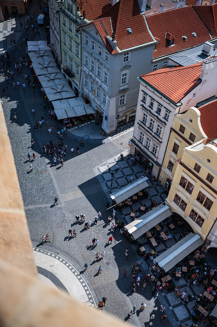 View of tourists, shops and restaurants from the tower of the Old Town Hall in Prague