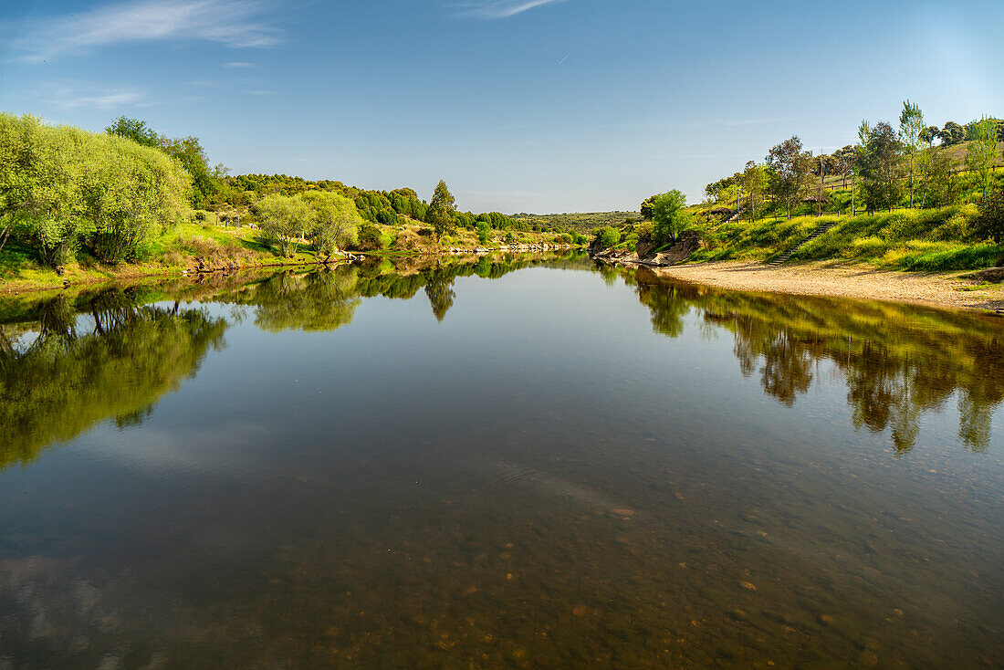 Tranquil river landscape along the Spain and Portugal frontier in Extremadura.