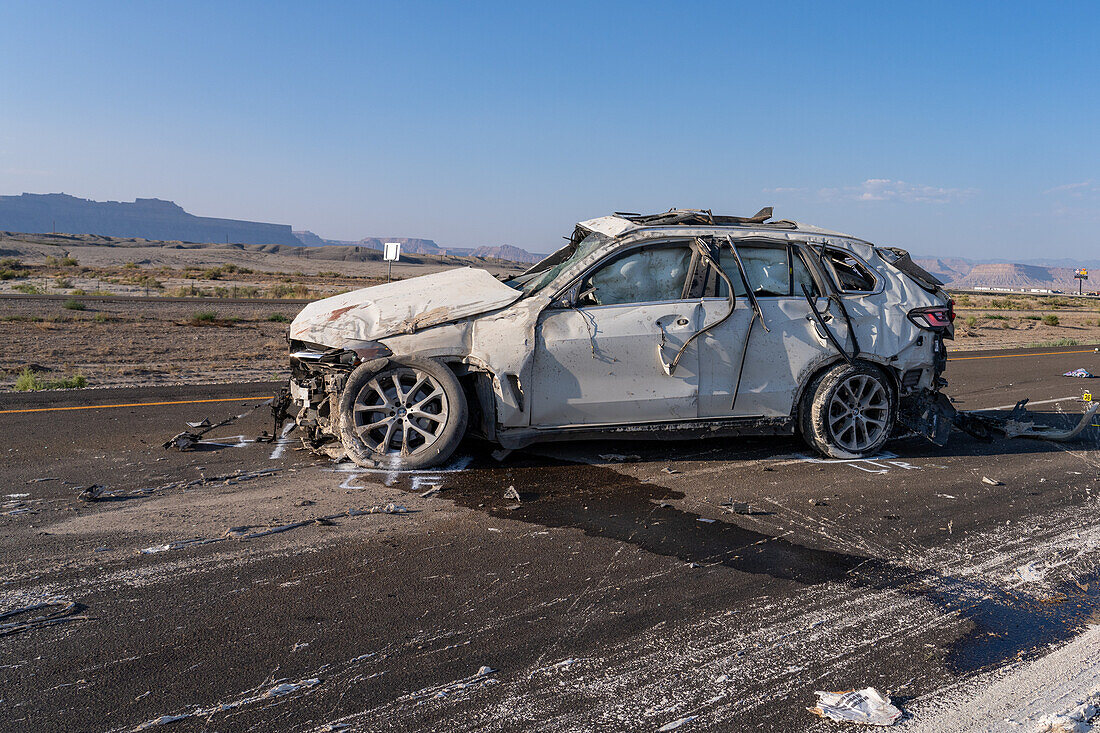 Law enforcement officers investigate a deadly auto crash in Utah.