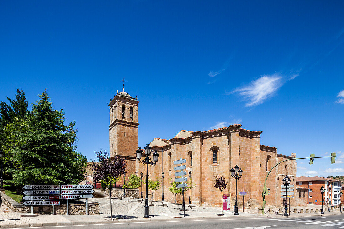 A view of the Colegiata Concatedral de San Pedro in Soria, Spain. The church is made of stone and has a tall bell tower