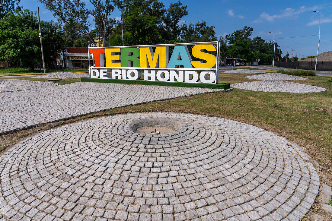 A painted metal sign in a roundabout on the outskirts of Termas de Rio Hondo, Argentina.