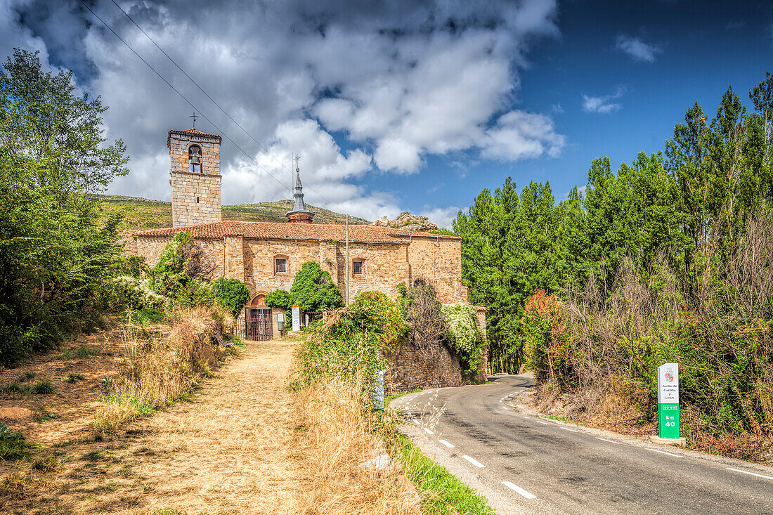 The Santa Maria Church stands prominently in Yanguas, Soria, showcasing its historic architecture amid a serene landscape.