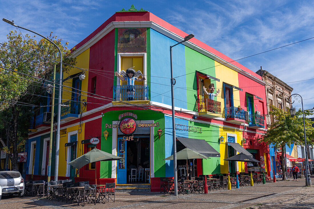 Caricature statues of football stars on balconies over a cafe in Caminito, La Boca, Buenos Aires, Argentina. Shown are Diego Maradona & Lionel Messi.