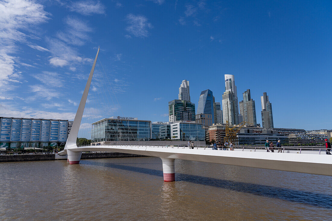 La Puente de la Mujer or the Woman's Bridge over Dock 3 in Puerto Madero, Buenos Aires, Argentina, with the Puerto Madero skyline.