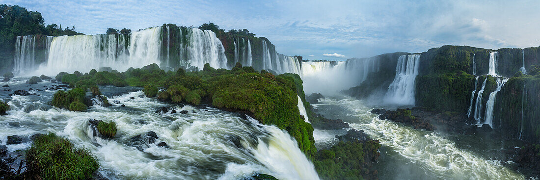 Iguazu Falls National Park in Argentina at right with Brazil at left. A UNESCO World Heritage Site. Pictured is the Floriano Waterfall at left with the top of the Santa Maria Falls in front and the Devil's Throat or Garganta del Diablo, center, and Salto Two Musketeers and the Three Musketeers Waterfall at right.