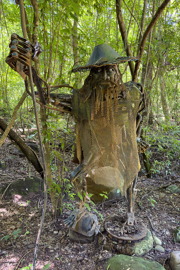 Metal sculpture of Coquena, a mythical creature along a trail in Calilegua National Park in Argentina. It is a character in Argentine folklore and a protector of animals of the mountains.