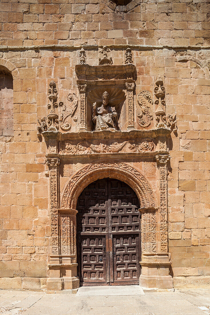 The intricate doorway of the Colegiata Concatedral de San Pedro showcases remarkable Romanesque architecture in Soria, Spain.