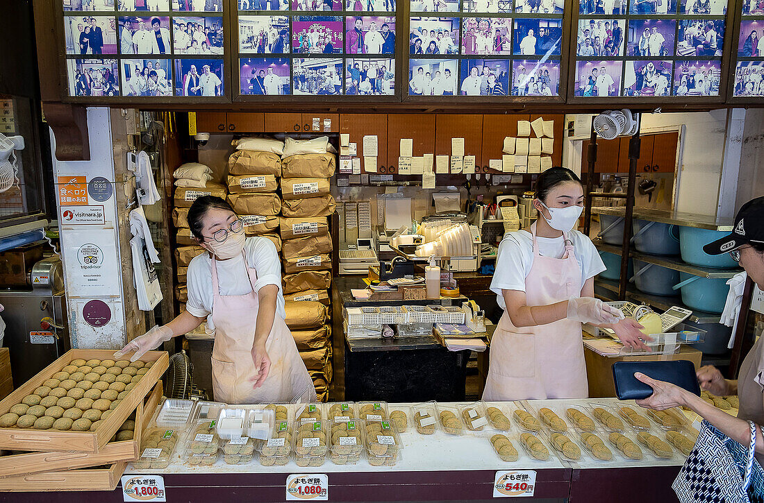 Selling the traditional Daifuku in Nakatanidou shop, made of soft rice cake (mochi) fill with sweet bean paste, in Nara Japan.