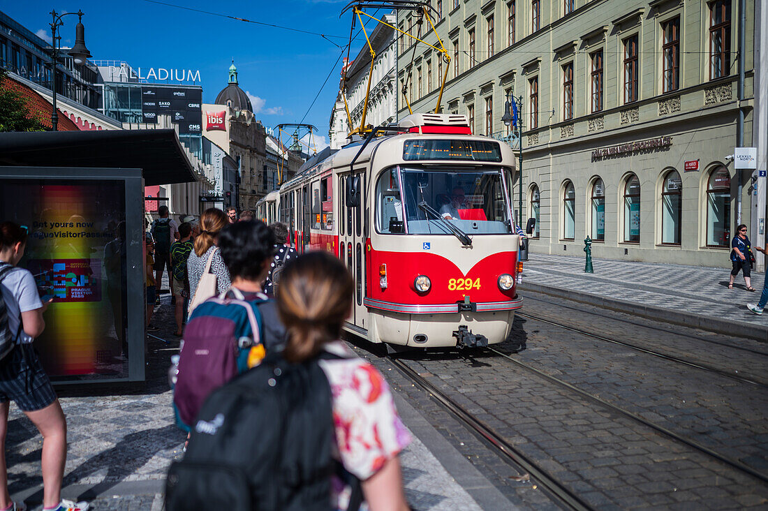 People waiting for the tram in Prague