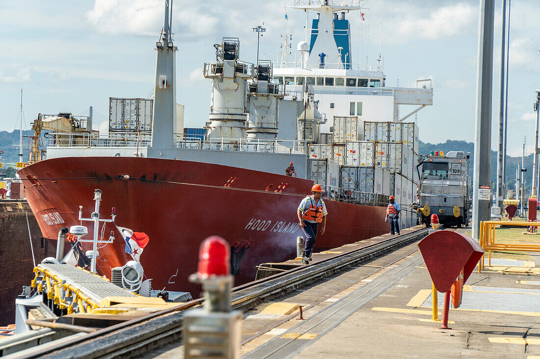 Cargo ship passing through Miraflores Locks in the Panama Canal.